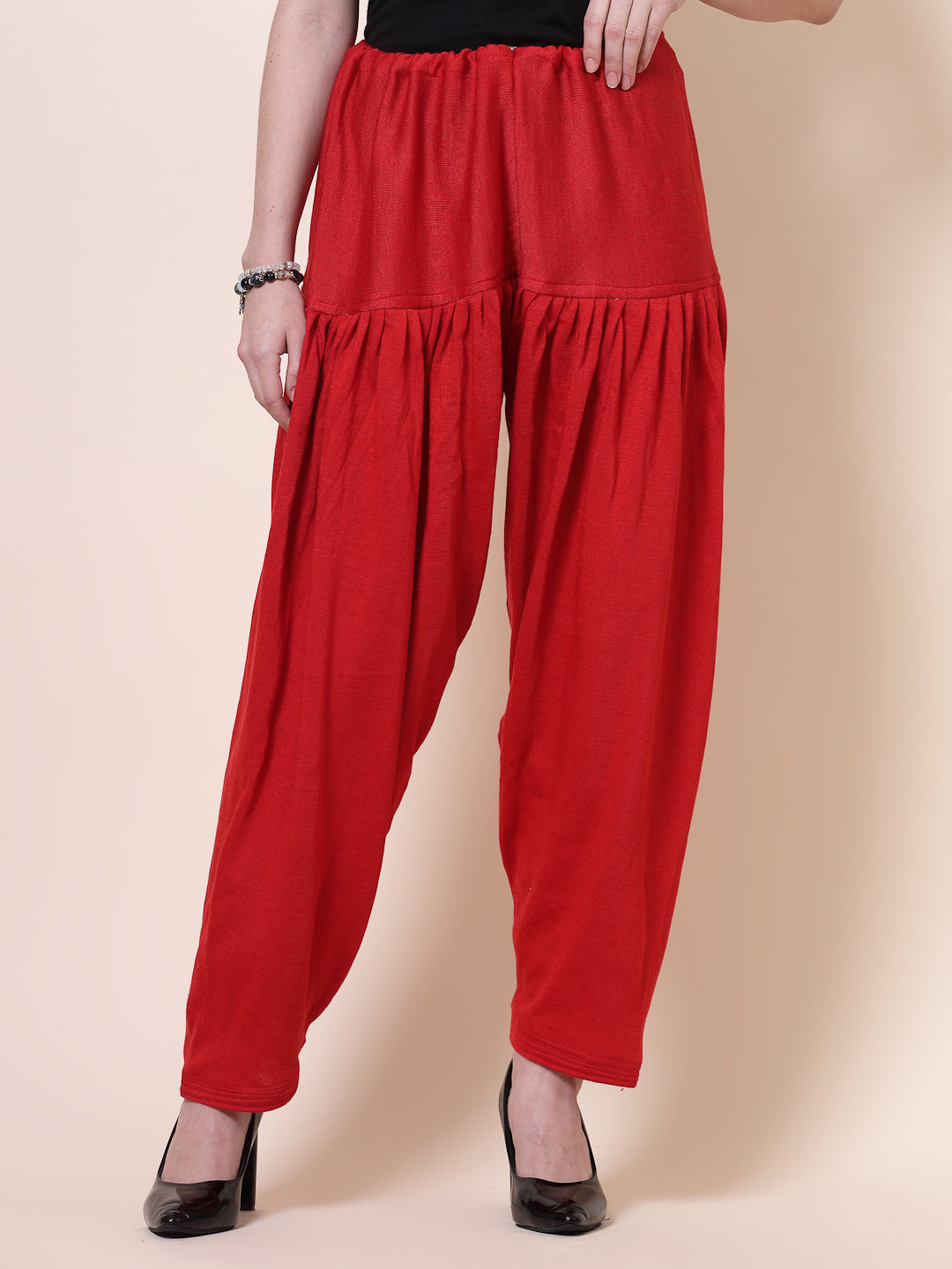 Red loose-fit woolen salwar with drawstring closure.