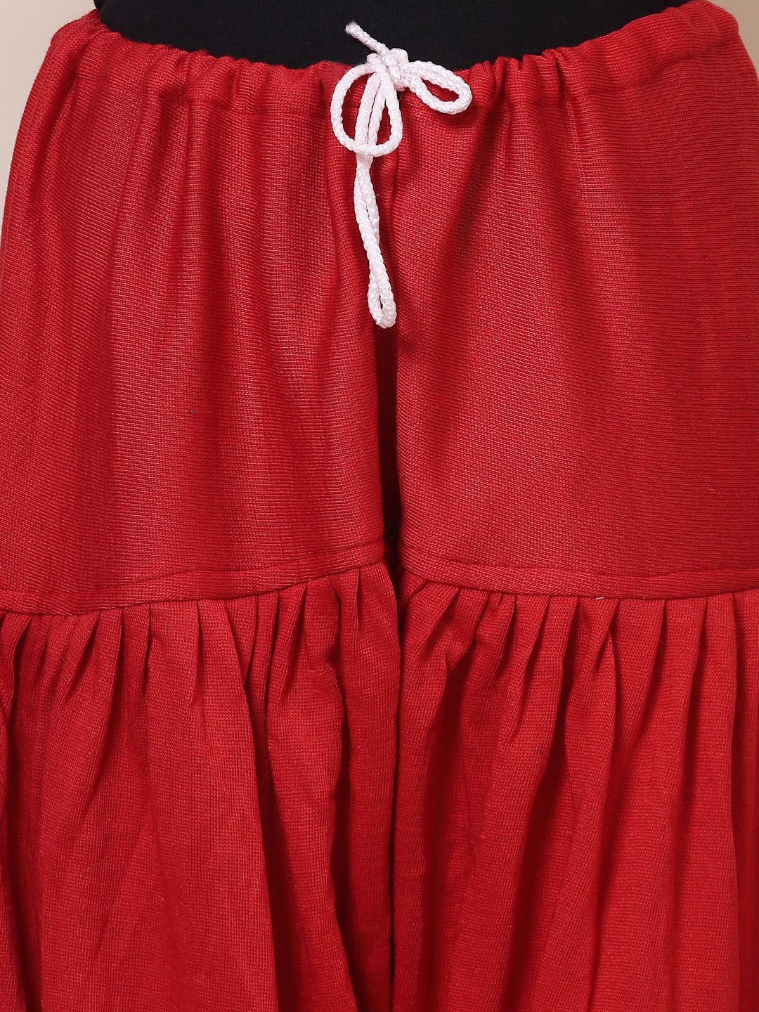 Red woolen loose-fit semi Patiala salwar with drawstring closure.