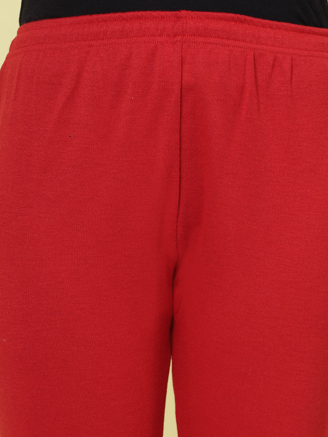 Black and red solid woolen leggings with elastic waistband and drawstring closure.