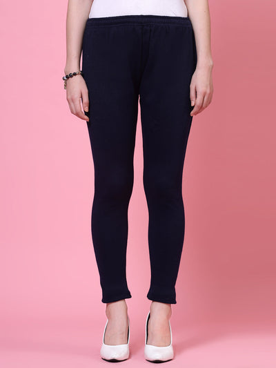 White and navy blue solid woolen leggings with elastic waistband and drawstring closure.