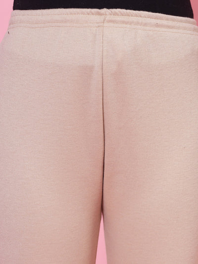 White and light fawn solid woolen leggings with elasticated waistband and drawstring closure.