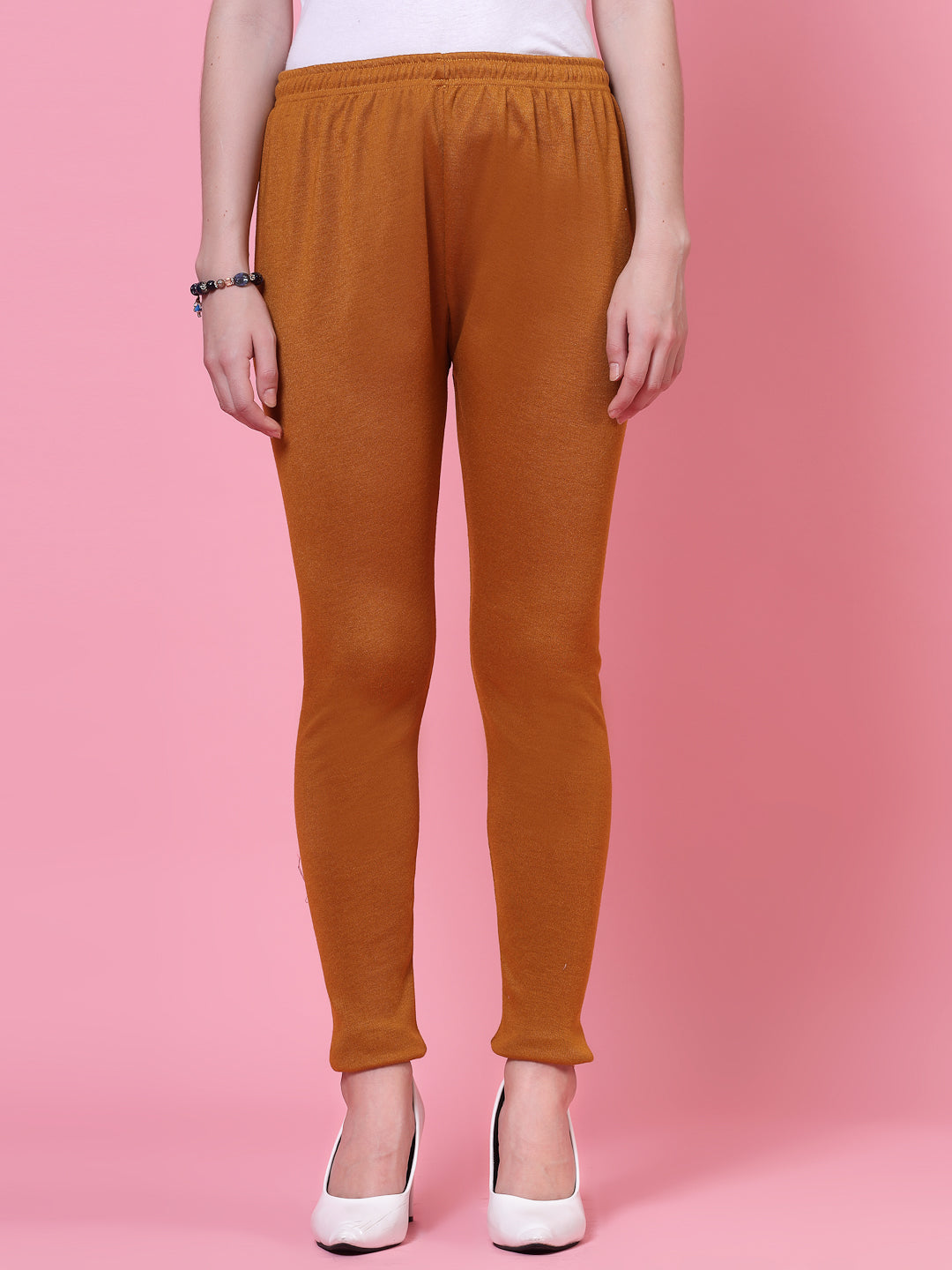 Mustard woolen leggings with elasticated waistband and drawstring closure.