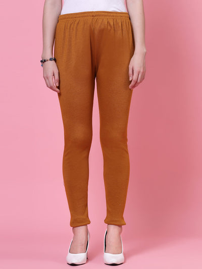 Mustard woolen leggings with elasticated waistband and drawstring closure.