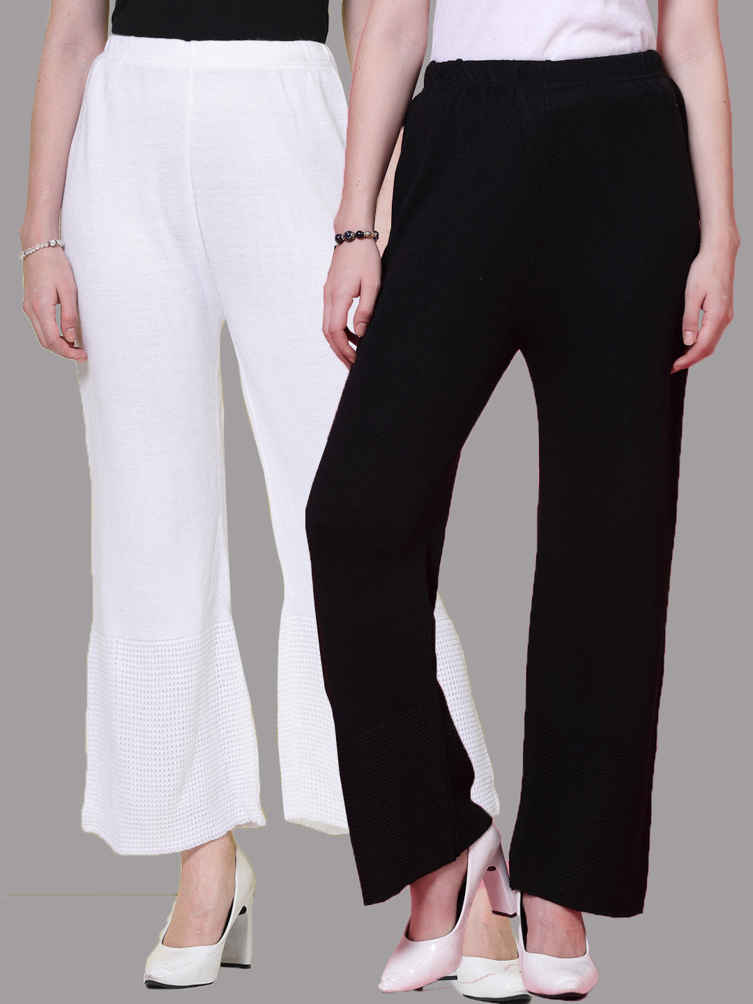 White and black solid woolen palazzo pants with elastic waistband.