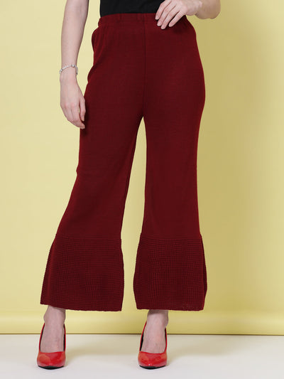 Red and maroon solid woolen palazzo pants with elastic waistband.