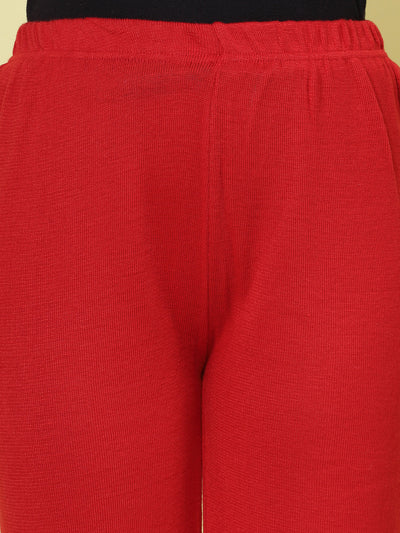 Red solid woolen palazzo with elasticated waistband.