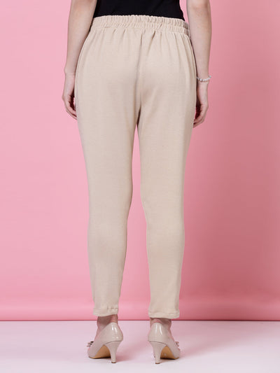 White and light fawn solid woolen trousers with elastic waistband and side pockets.