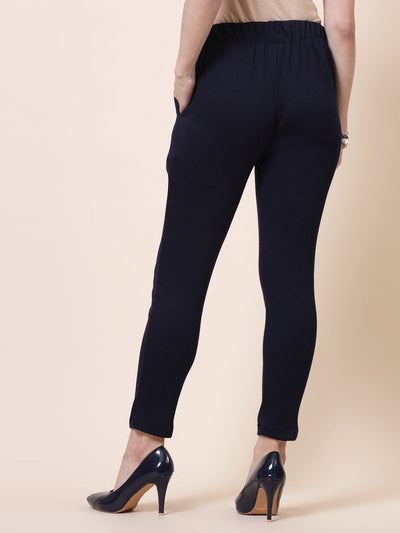 White and navy blue solid woolen trousers, elasticated waistband, two side pockets.