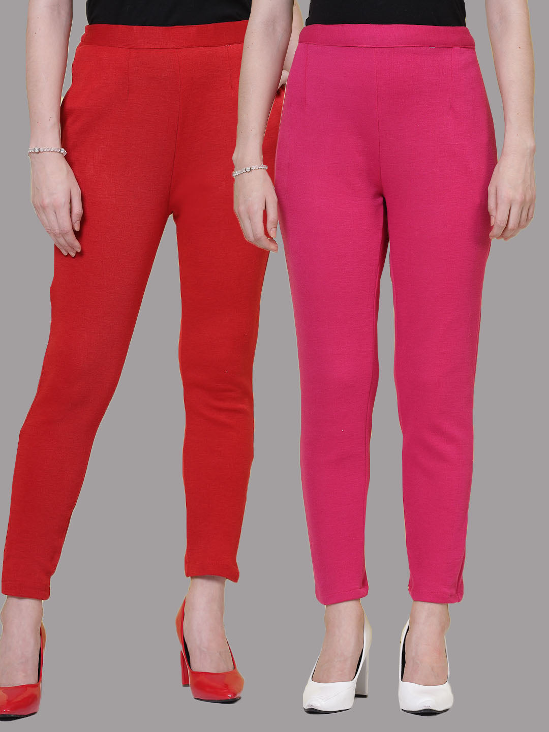 Red and magenta solid woolen trousers with elasticated waistbands and side pockets.