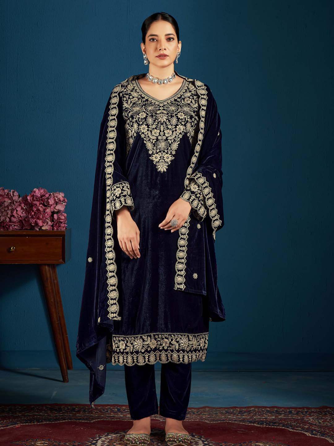 Navy blue embroidered velvet kurta with dupatta set featuring intricate detailing on the front, sleeves, and hem.