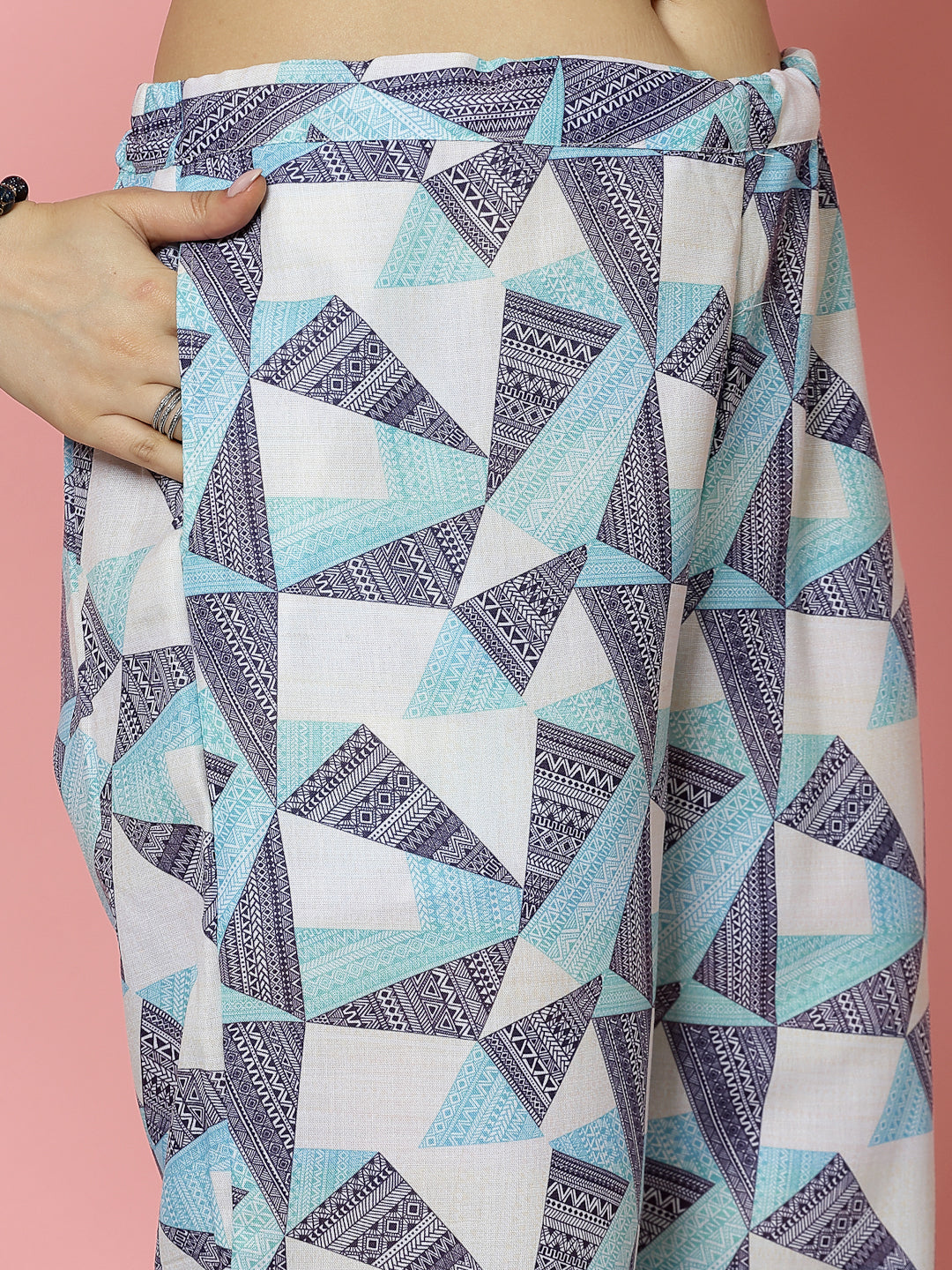 Printed shirt and trouser co-ords set with geometric pattern, featuring a shirt collar and elasticated waistband.