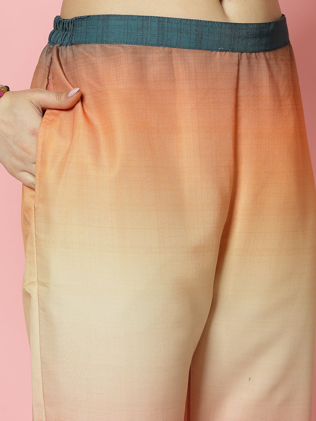 Ombre design trousers with elastic waistband and gradient pattern.