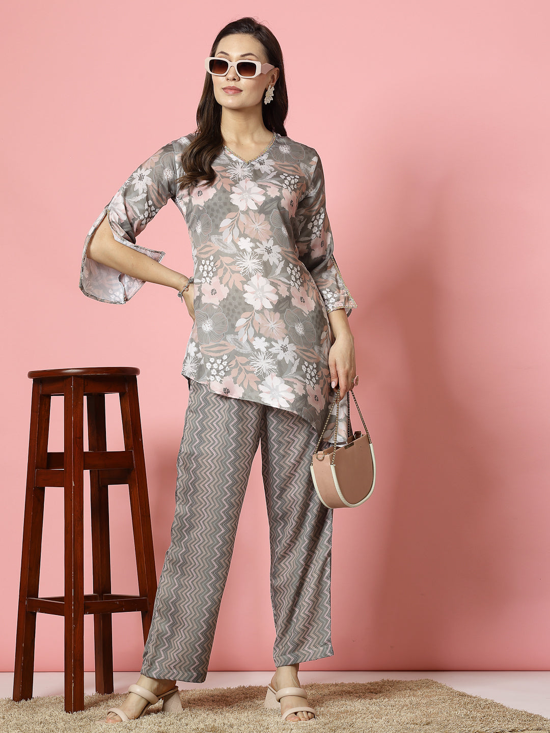 Printed floral tunic with three-quarter sleeves and zig-zag patterned trousers co-ords.