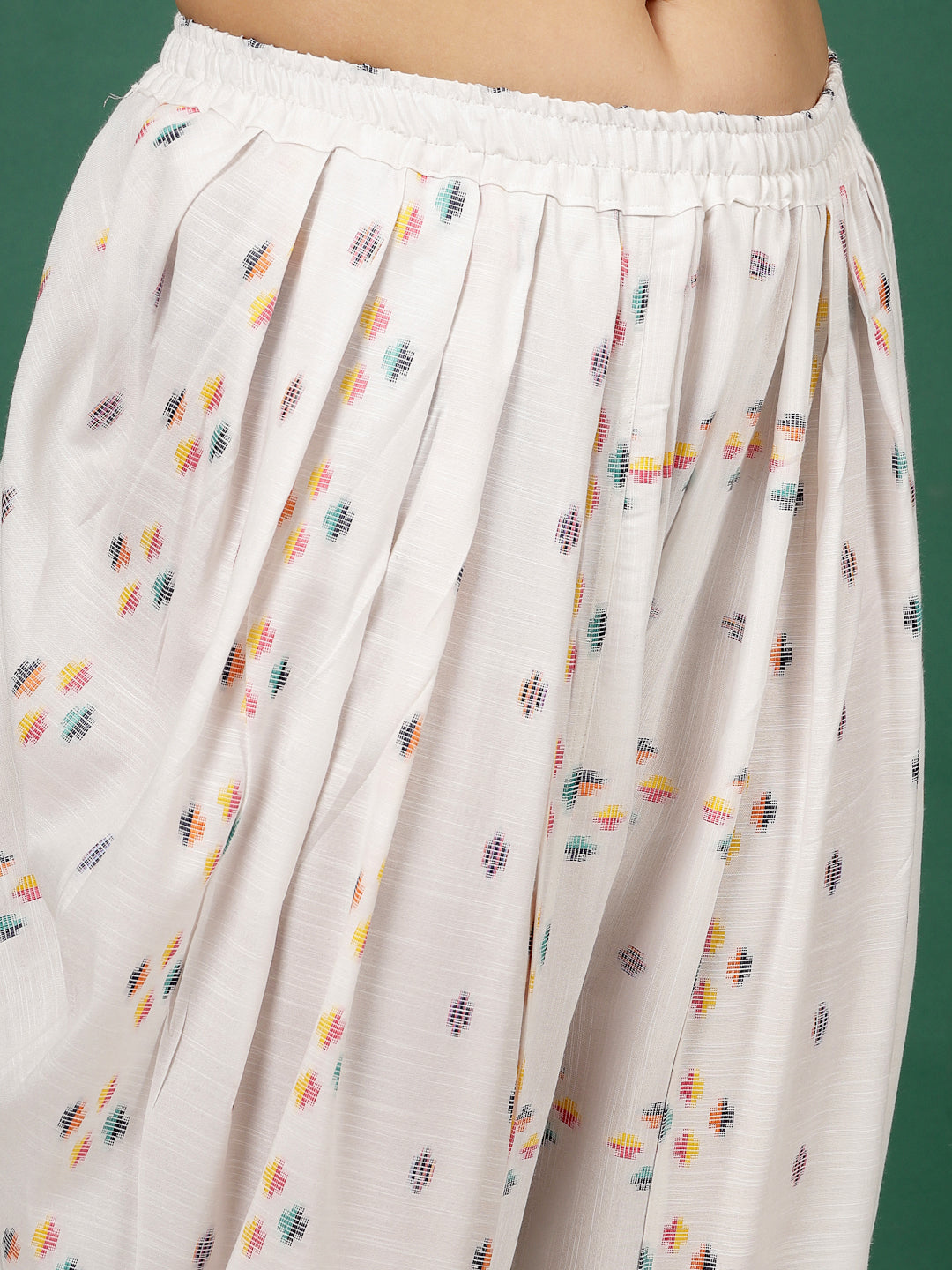 White Ikat printed shirt collar tunic with dhoti co-ords featuring multicolored patterns and elasticated waistband.