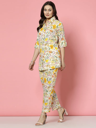 Yellow floral printed shirt and trouser co-ords with roll-up sleeves and elastic waistband.