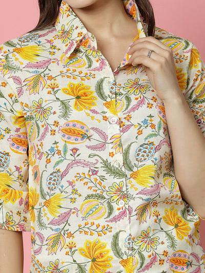 Yellow floral printed shirt with button closure and roll-up sleeves.