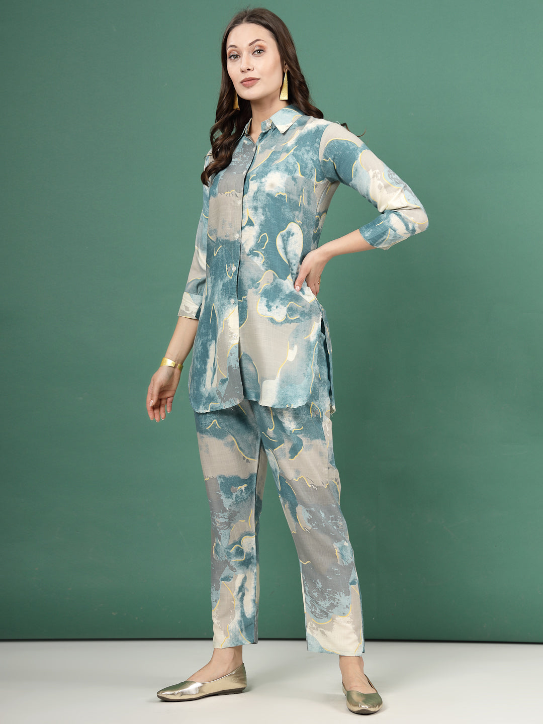 Printed shirt and trouser co-ords with abstract design, three-quarter sleeves, and elasticated waistband.