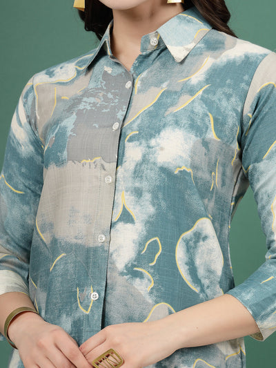 Printed shirt with abstract design, three-quarter sleeves, and button placket.