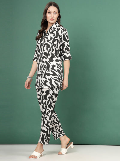 Abstract printed shirt with trousers co-ords, three-quarter sleeves, and elasticated waistband.