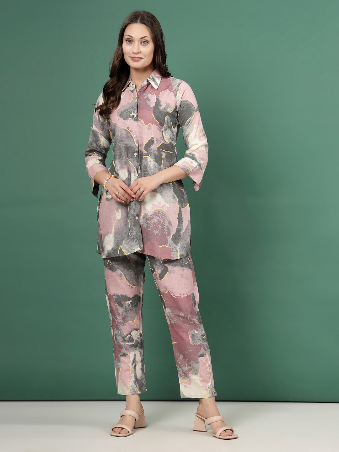 Printed shirt with abstract design and matching trousers set.