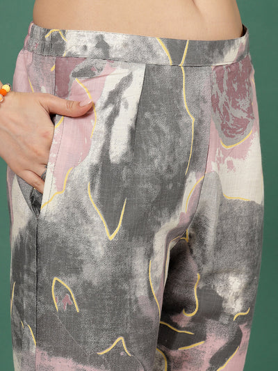 Abstract printed trousers with elastic waistband and slip-on closure.