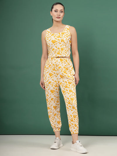 Printed sleeveless top with joggers in mustard abstract pattern, round neck, crop length, and elastic waistband.