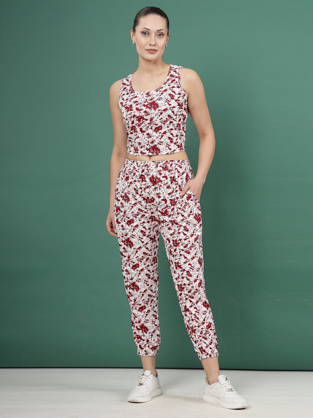 Printed sleeveless top with maroon abstract pattern and matching joggers co-ords.