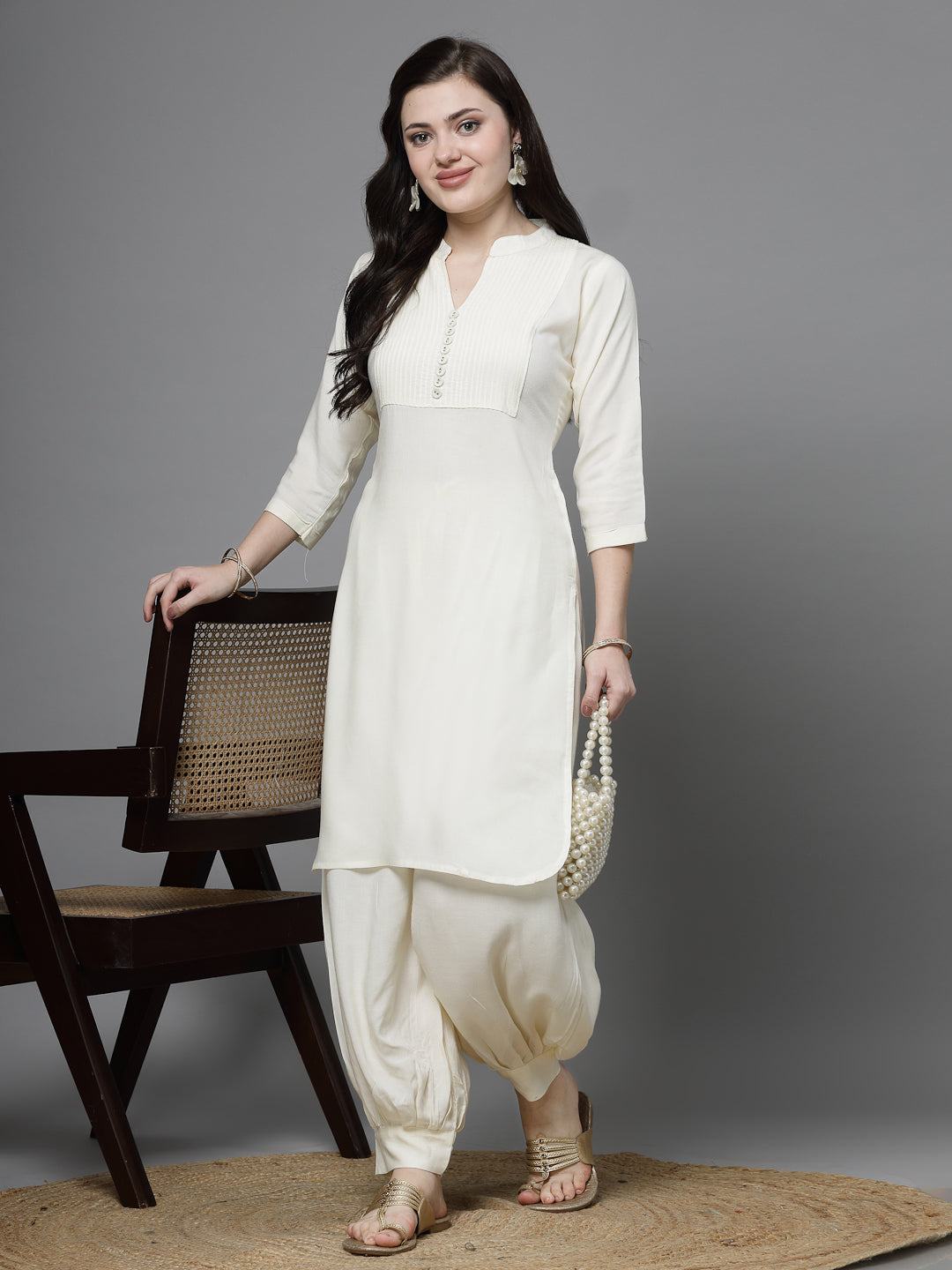 Yoke Design Kurta with Afghani Pants in off-white featuring three-quarter sleeves and mandarin collar.