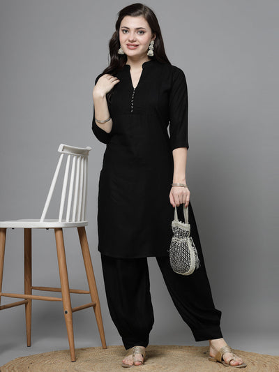 Yoke design black kurta with Afghani pants, mandarin collar, three-quarter sleeves.