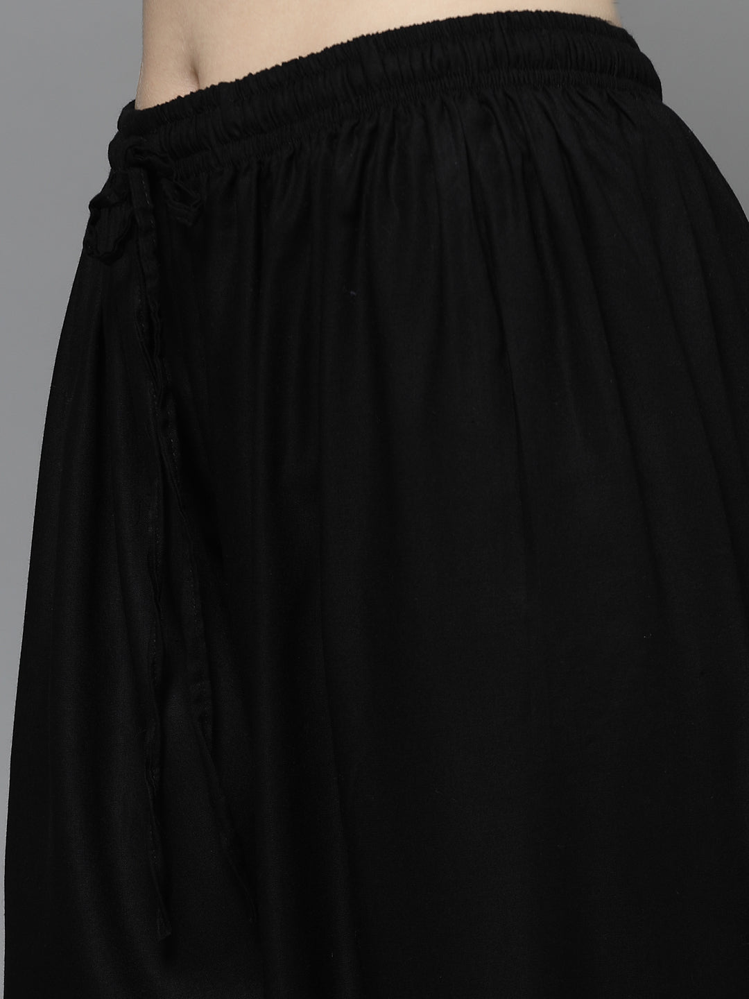 Yoke design kurta with Afghani pants in black, featuring mandarin collar and elasticated waistband.