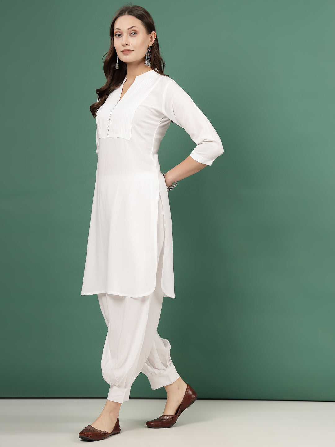 Yoke Design Kurta with white Afghani pants, featuring three-quarter sleeves and mandarin collar.