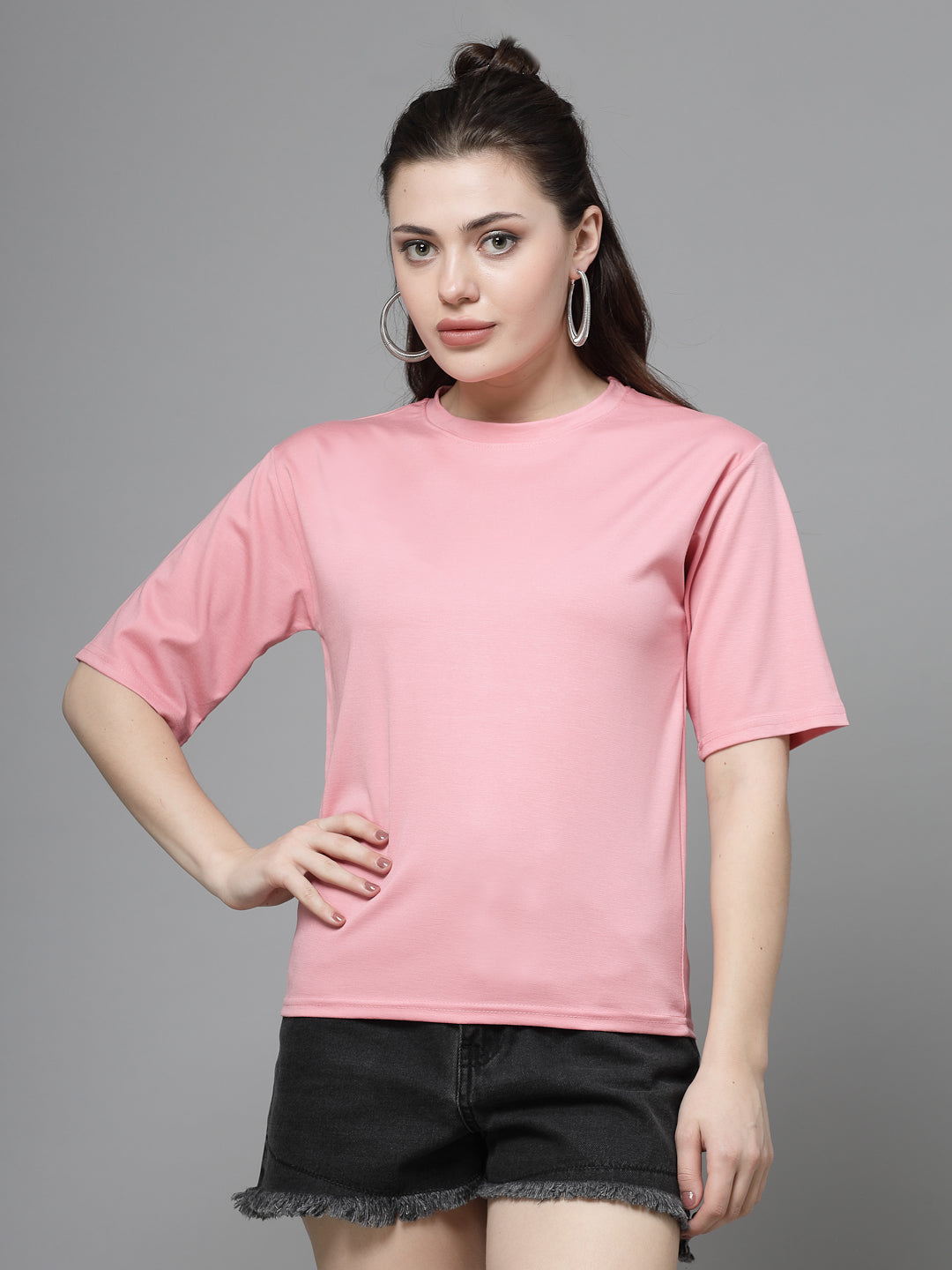 Pink solid regular fit T-shirt made from premium Tencel fabric for women.