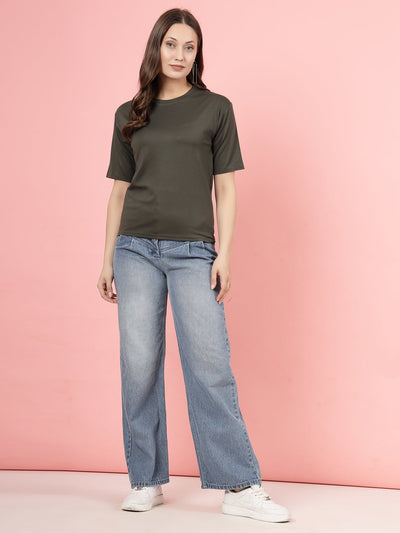 Olive solid regular fit Tencel women's T-shirt with jeans.