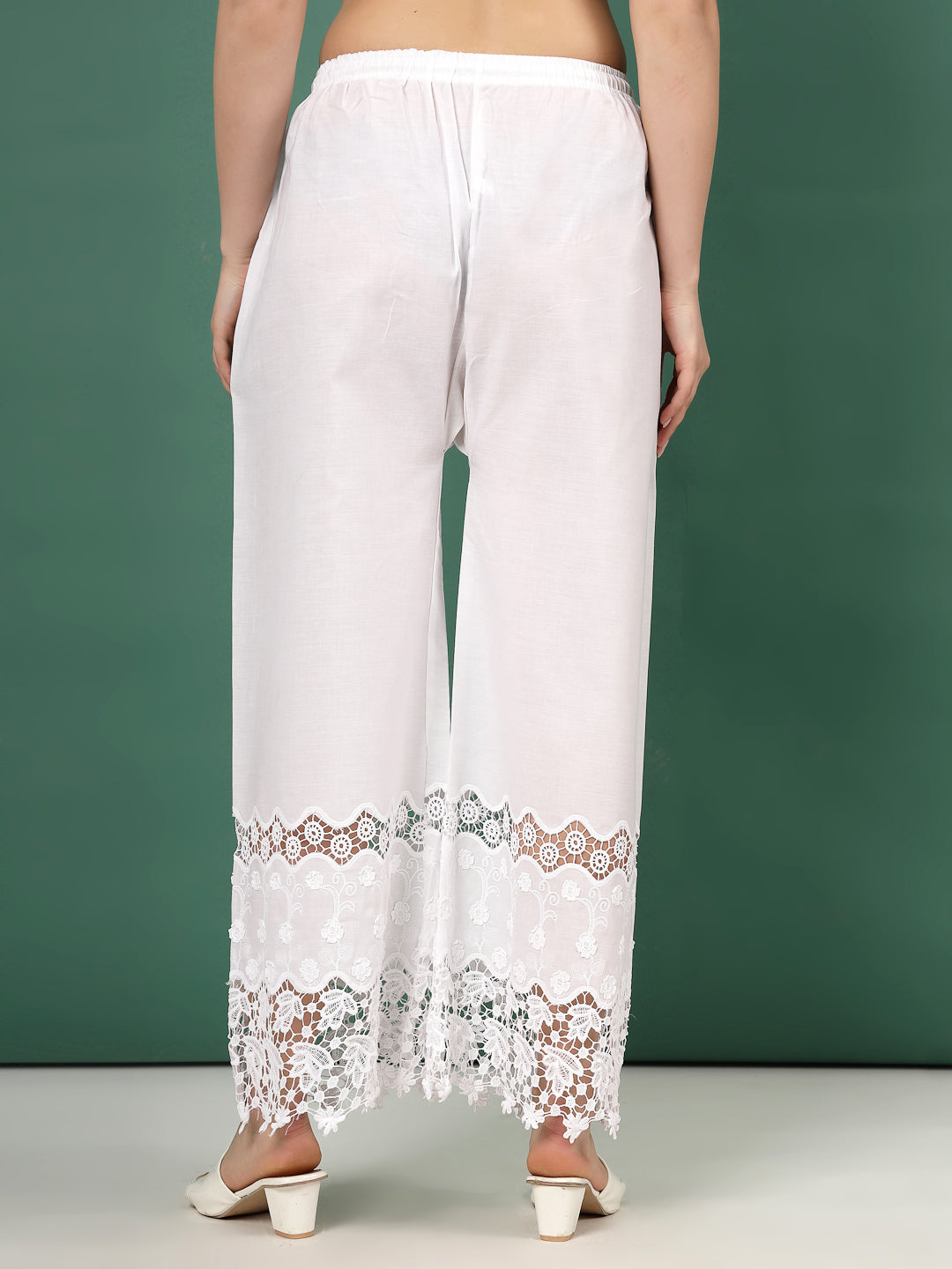 White Palazzo Pants with intricate lace accent and cut work hem design.