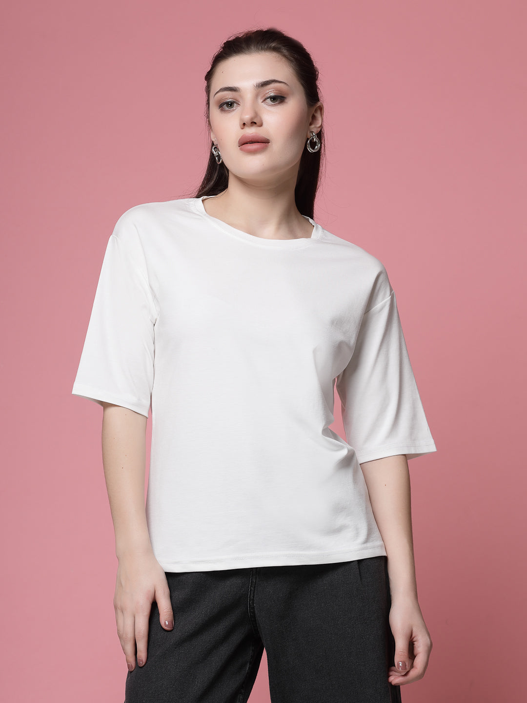 Solid white regular fit t-shirt with round neck and short sleeves.