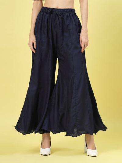 Women solid navy blue flared rayon sharara with elasticated waistband.