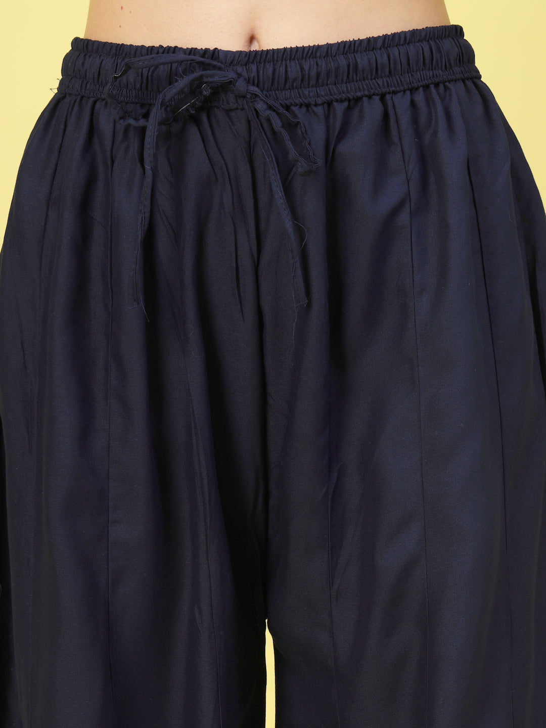 Women solid navy blue flared rayon sharara with elasticated waistband.