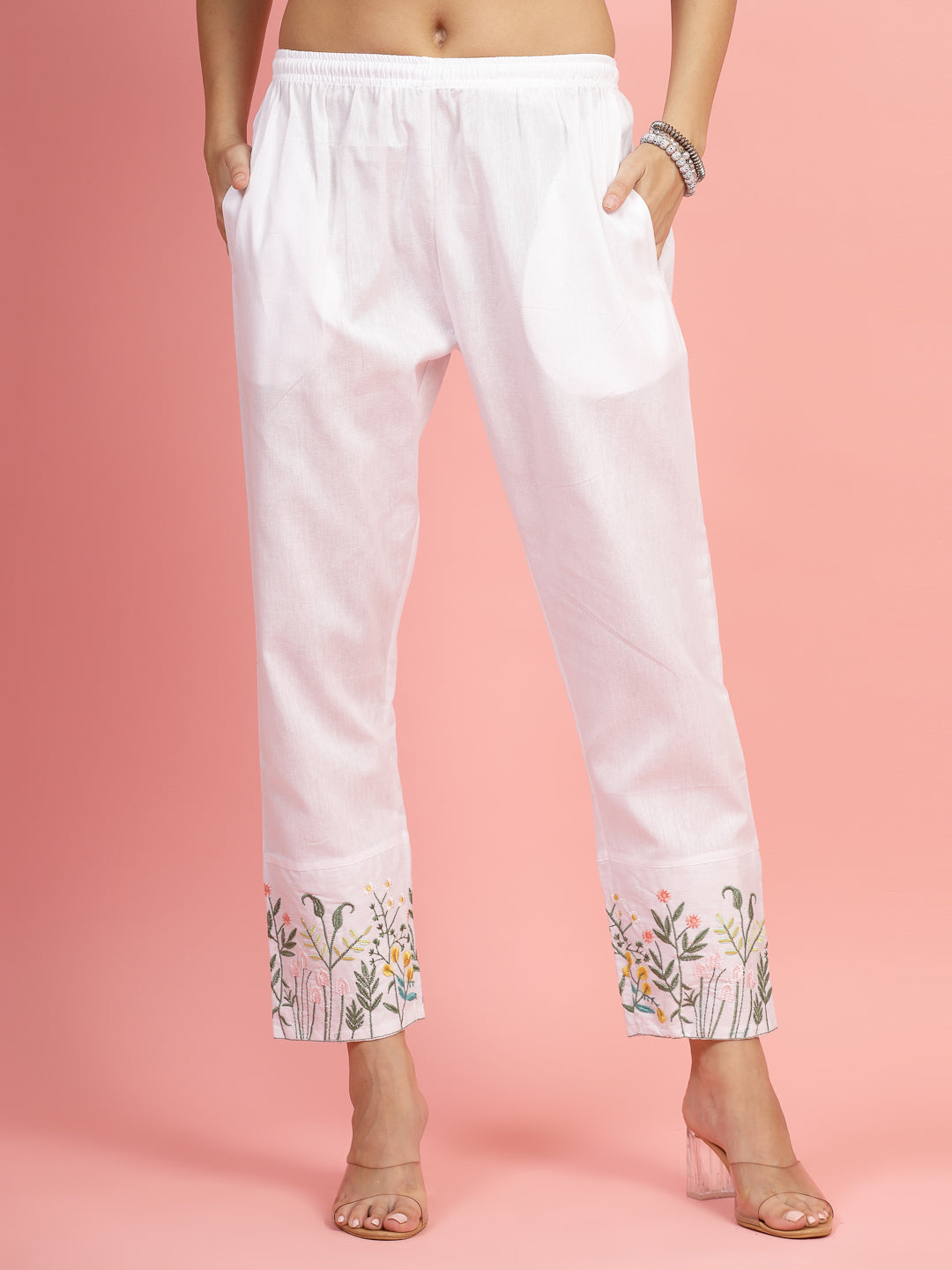 Women embroidered hem design mid-rise pants with regular fit and flat-front style.