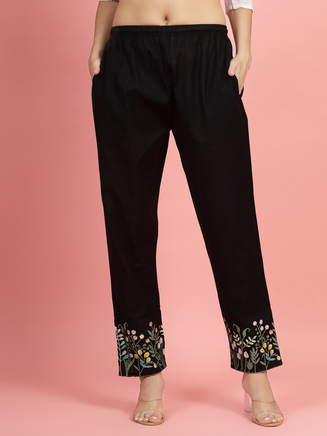 Women embroidered hem design mid-rise pants with regular fit and flat-front style.