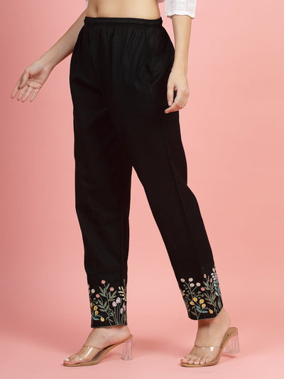 Women mid-rise pants with embroidered hem design, regular fit, flat-front, and two pockets.