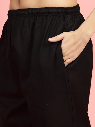 Women mid-rise pants with embroidered hem design, regular fit, flat-front, and two pockets.