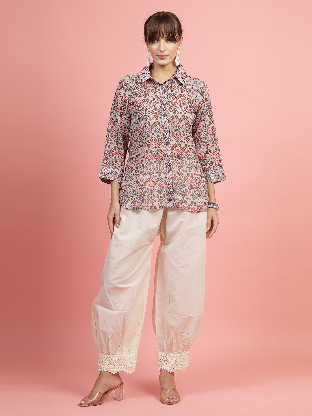 Women wearing off-white cotton loose fit Afghani salwar, showcasing a traditional yet modern style.