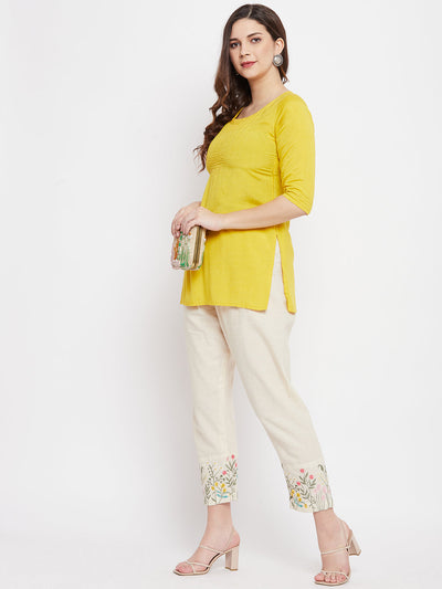 Women mid-rise embroidered hem design pants with regular fit.