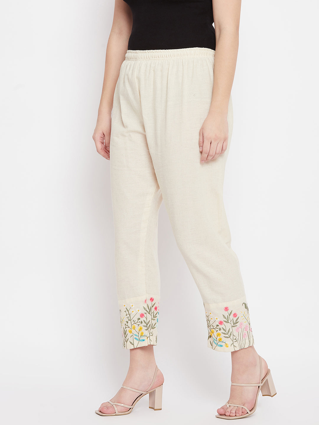 Women embroidered hem design mid-rise pants with regular fit and flat-front style.