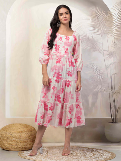 Women Pink Printed Fit & Flare Dress with floral design and long sleeves.