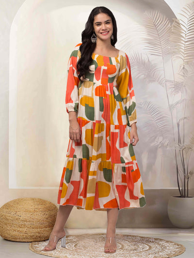 Women orange printed fit & flare dress in viscose rayon fabric.