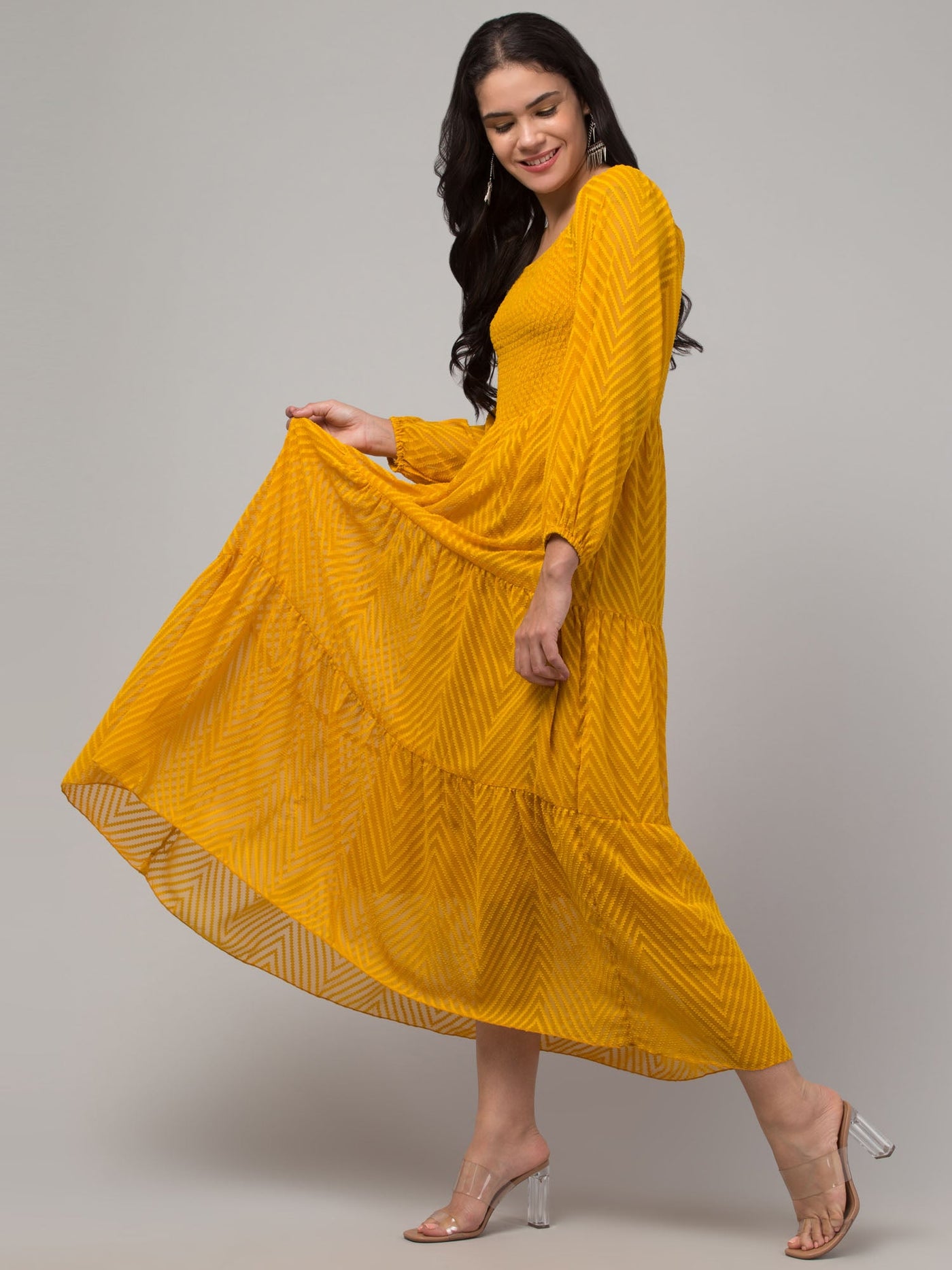 Women Mustard Printed Fit & Flare Dress in Georgette fabric with long sleeves, showcasing a blend of tradition and modernity.