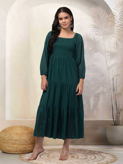 Women bottle green printed fit & flare dress in georgette fabric.