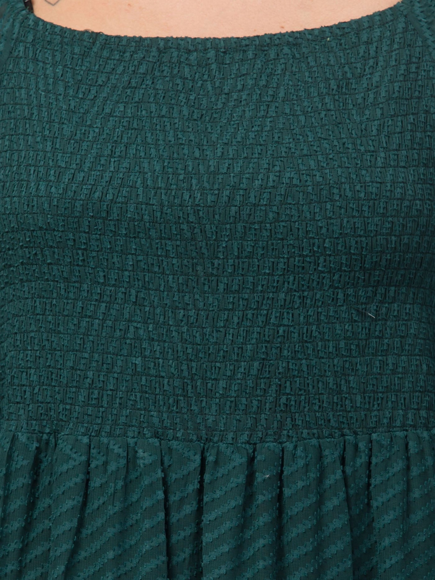 Women Bottle Green Printed Fit & Flare Dress in Georgette fabric, close-up view.