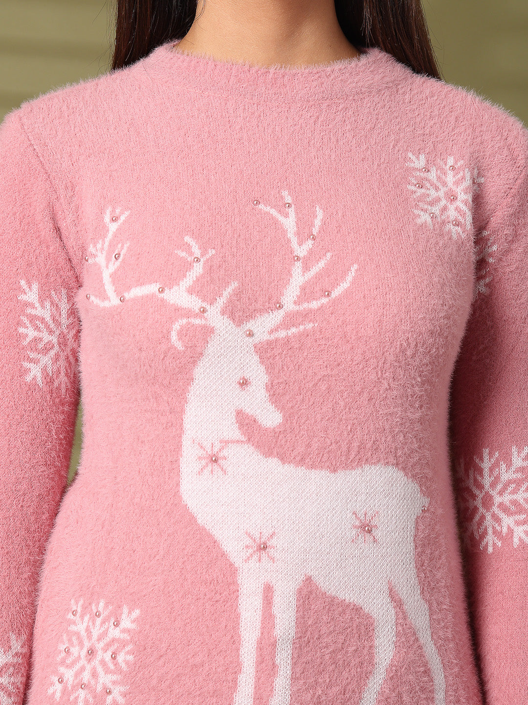 Pink embellished woolen top with delicate winter-themed design.